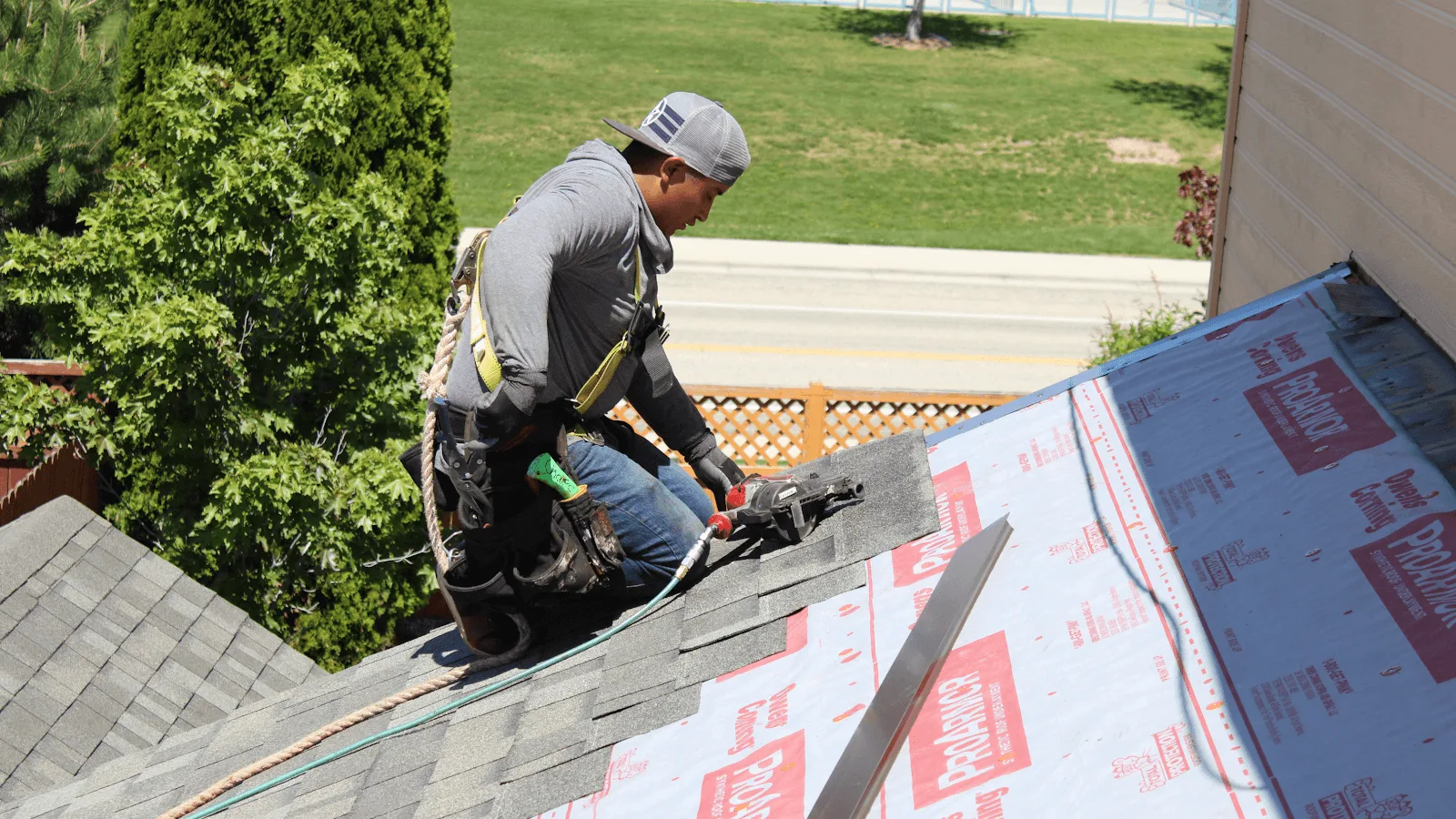 roofer repairing shingles on a Castle Rock Colorado home